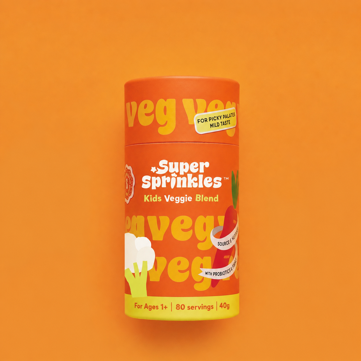 A cylindrical container of Veg Veg Super Sprinkles Kids Veggie Blend on a solid orange background. The packaging is bright orange with yellow and white text and graphics depicting broccoli and carrots.