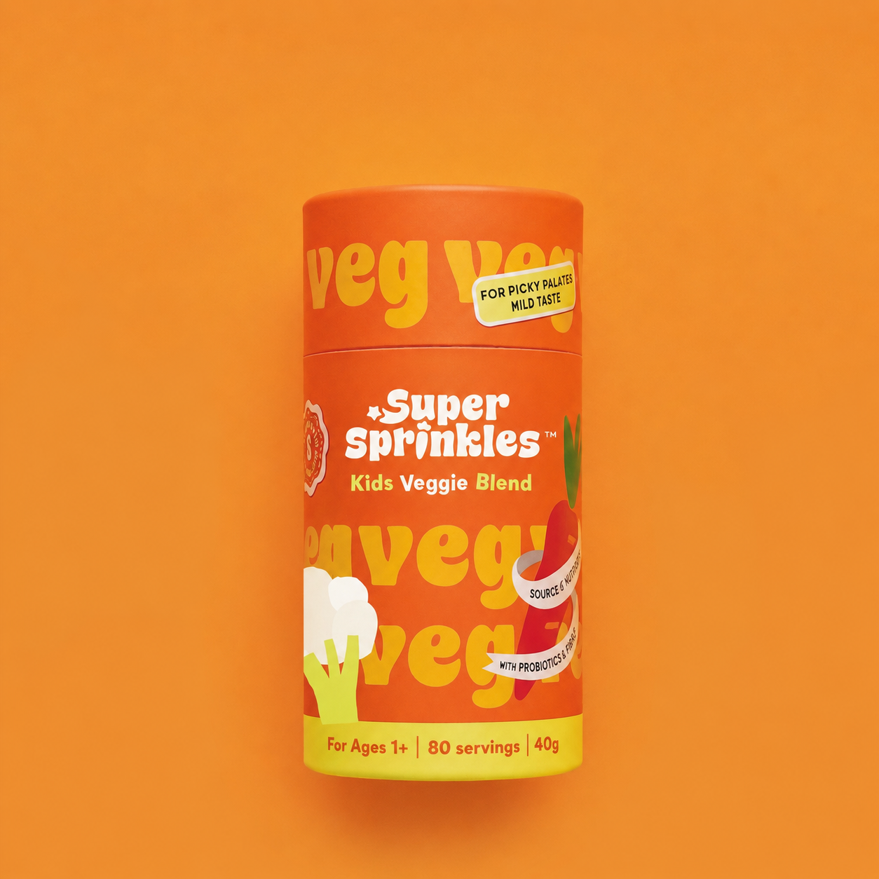 A cylindrical container of Veg Veg Super Sprinkles Kids Veggie Blend on a solid orange background. The packaging is bright orange with yellow and white text and graphics depicting broccoli and carrots.