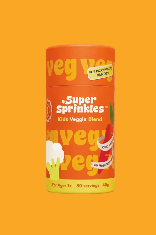 A cylindrical container of  Super Sprinkles Kids Veggie Blend on a solid orange background. The packaging is bright orange with yellow and white text and graphics depicting broccoli and carrots.